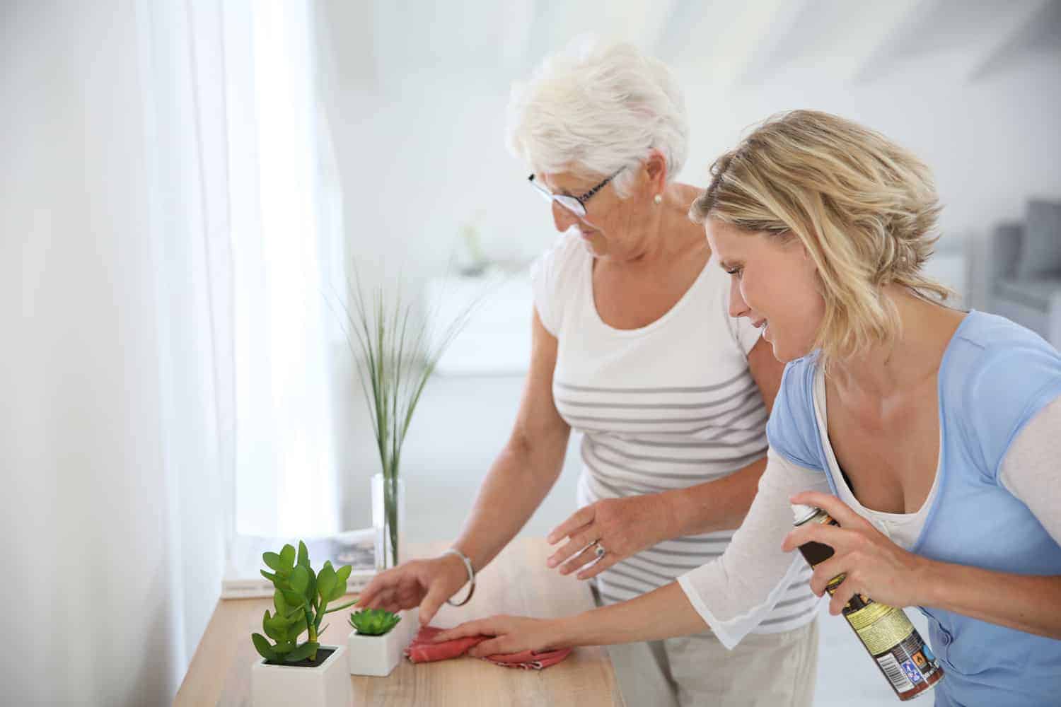A person helping a resident clean