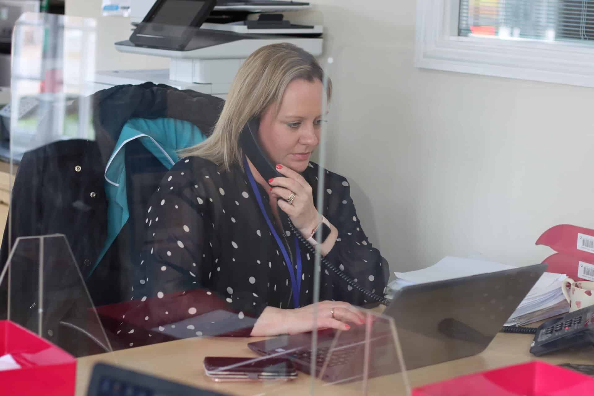 Member of Care team on the phone